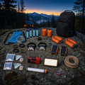 The Stronghold contents: gravity filter, four water filter straws, four emergency bivies, four bracelets, two headlamps, two solar power banks, two water test kits, crank radio, LED panel, tube light, compass and pack